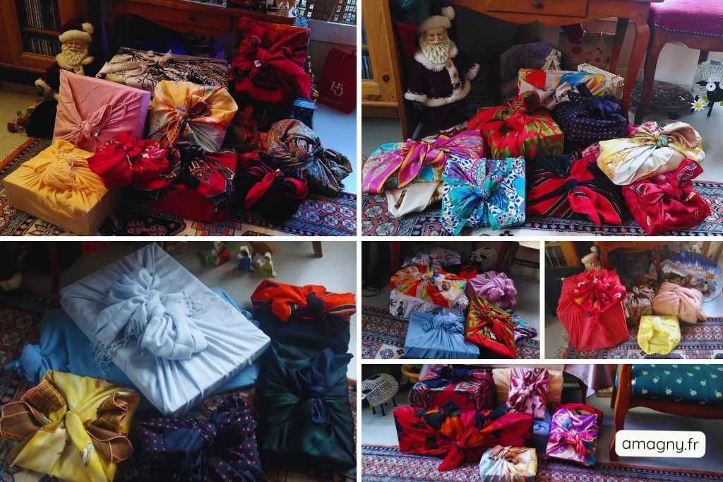 Cadeaux de Noël emballés avec la technique japonaise du furoshiki, tissus colorés noués sur un tapis décoré